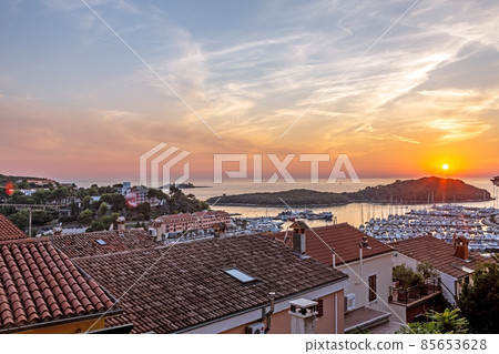 Panorama over the harbor of the Croatian coastal town Vrsar taken from the old town during the sunset Panorama over the harbor of the Croatian coastal town Vrsar taken from the old town during the sunset 85653628