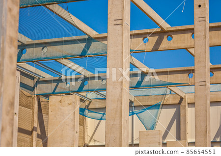 Construction site with precast concrete columns, beams and walls Construction site with precast concrete columns, beams and walls 85654551