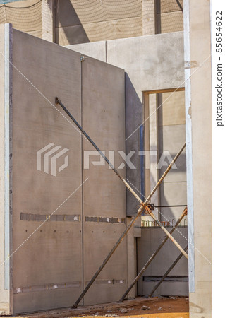 Construction site with precast concrete columns, beams and walls Construction site with precast concrete columns, beams and walls 85654622