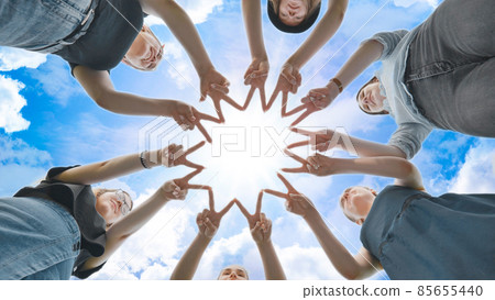 Girlfriends girls make circle shapes from their fingers and hands and then connect them. 85655440
