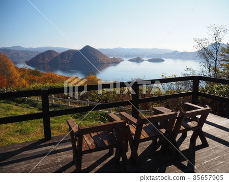 Resting place with chairs overlooking Lake Toya 85657905