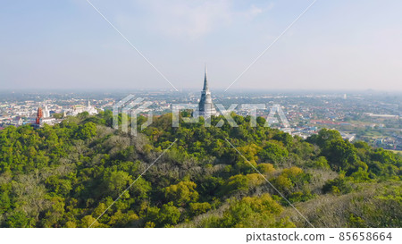 Aerial top view of Phra Nakhon Khiri Historical Park or Khao Wang, Phetchaburi urban city town with forest trees and green mountain hills. Nature landscape background, Thailand. 85658664