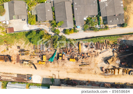 Aerial top view of factory industry. Electricity tower building in energy, transportation, logistic or environment concept. Manufacturing workshop station. Aerial top view of factory industry. Electricity tower building in energy, transportation, logistic or environment concept. Manufacturing workshop station. 85658684