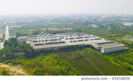 Aerial top view of factory industry. Electricity tower building in energy, transportation, logistic or environment concept. Manufacturing workshop station. 85658699