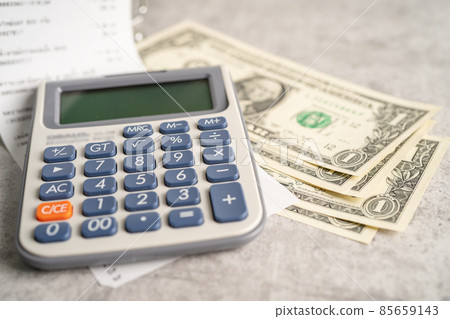 Grocery shopping list receipts with calculator and US dollar banknotes money. Grocery shopping list receipts with calculator and US dollar banknotes money. 85659143