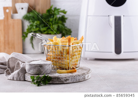 French fries cooked in air fryer. French fries cooked in air fryer. 85659345