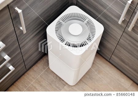 White air purifier in the kitchen of the apartment 85660148