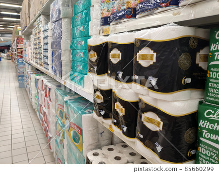 PENANG, MALAYSIA -JANUARY 2, 2022: Selective focused on bathroom tissue & kitchen towel on display for sale in a supermarket. Sorted by brand and labeled with a price tag. 85660299