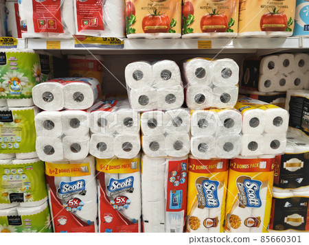 PENANG, MALAYSIA -JANUARY 2, 2022: Selective focused on bathroom tissue & kitchen towel on display for sale in a supermarket. Sorted by brand and labeled with a price tag. 85660301