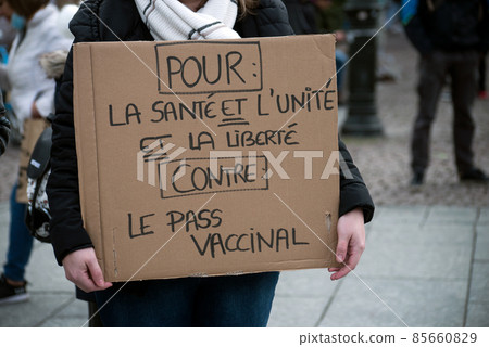 Strasbourg - France - 8 January 2022 - People protesting against the sanitary pass with text in french : Contre le pass vaccinal, in english : against the vaccine pass 85660829