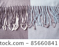 cashmere wool scarf with fringe background. Top view 85660841