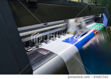 Large format inkjet printer working on vinyl paper in workplace Large format inkjet printer working on vinyl paper in workplace 85661502