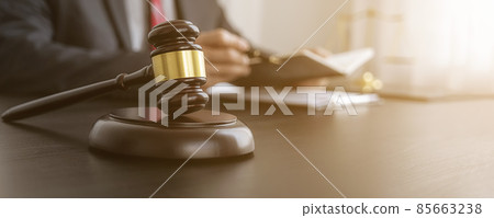 Professional lawyer considering with contract papers in courtroom. Justice, Law, Attorney and Court judge concept. Professional lawyer considering with contract papers in courtroom. Justice, Law, Attorney and Court judge concept. 85663238