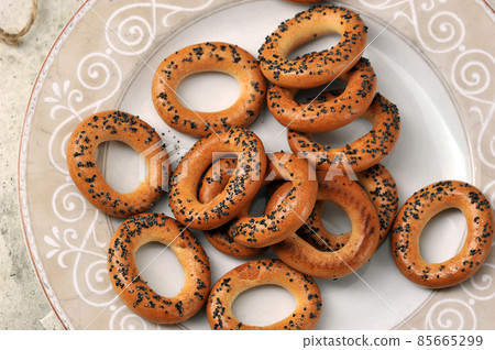 bagels with poppy seeds on a plate 85665299