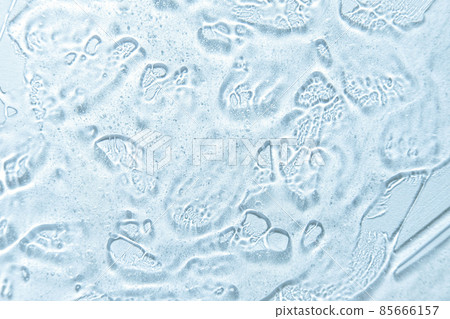 Bubble gel texture. Natural gel texture. Transparent liquid gel spot on blue background. Textured smear with oxygen bubbles. Clear liquid gel bubbles texture. Face serum, hand santizer swatch 85666157