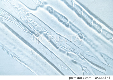 Gel texture background in cold blue colors. Banner for moisturizing cosmetic presentation. Antiseptic wallpaper. Hydration medical. Liquid gel cosmetic smudge. Transparent cosmetic sample Gel texture background in cold blue colors. Banner for moisturizing cosmetic presentation. Antiseptic wallpaper. Hydration medical. Liquid gel cosmetic smudge. Transparent cosmetic sample 85666161