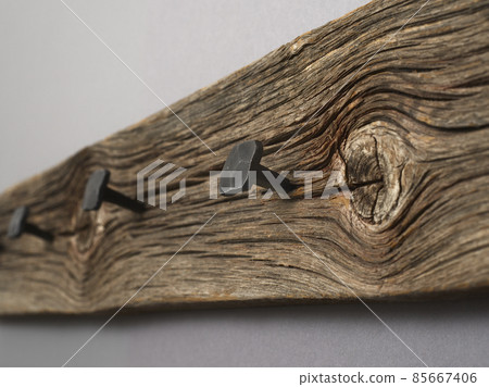 coat rack, old board with hammered forged nails 85667406