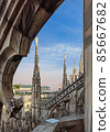 Top view from the roof of Duomo di Milano Cathedral with marble statues. Milan, Italy. 85667682