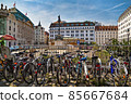 Am Hof Platz square with Marian Column and Performing arts theater Wiener Lustspielhaus. City bike parking is in the foreground. Vienna, Austria. 85667684