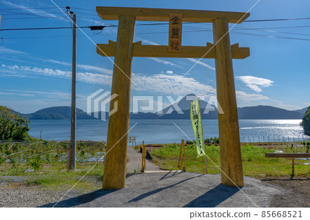 Kaimondake, Lake Ikeda and the golden torii Kaimondake, Lake Ikeda and the golden torii 85668521