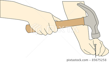 A person who hits a nail with a hammer 85675258