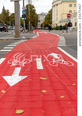 bike lane or red road with signs of bicycles 85675467
