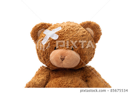 teddy bear toy with medical patch on head 85675534