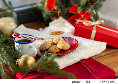 cookies, coffee and christmas gift on sill at home 85675569