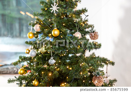 close up of decorated christmas tree at home close up of decorated christmas tree at home 85675599