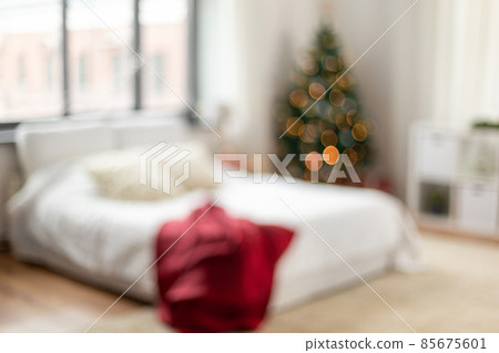 blurred bed in bedroom at cozy home on christmas blurred bed in bedroom at cozy home on christmas 85675601