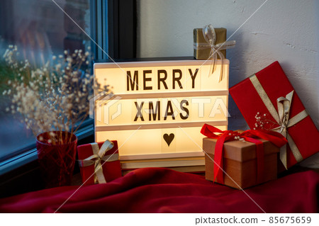 merry christmas on light box and gifts on window merry christmas on light box and gifts on window 85675659