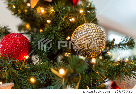 close up of golden ball on christmas tree 85675786