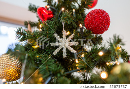 close up of snowflake decoration on christmas tree 85675787