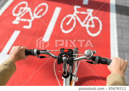 close up of bicycle's wheel on bike lane in city 85676512
