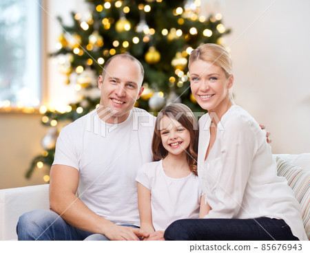 portrait of happy family at home on christmas 85676943