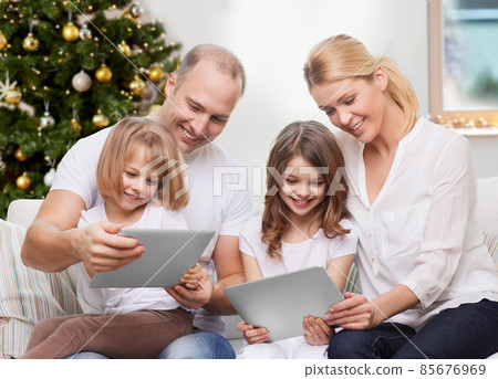 happy family with tablet pc at home on christmas 85676969