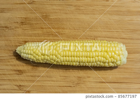 Close up shot of a raw corn Close up shot of a raw corn 85677197