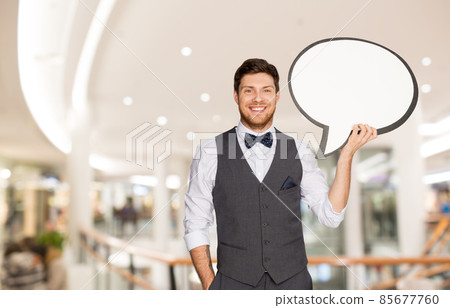 happy man holding text bubble at shopping mall happy man holding text bubble at shopping mall 85677760
