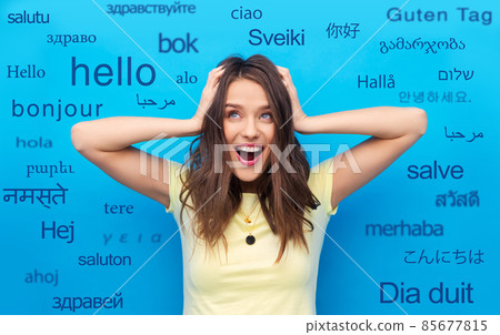woman holding to her head over foreign languages woman holding to her head over foreign languages 85677815