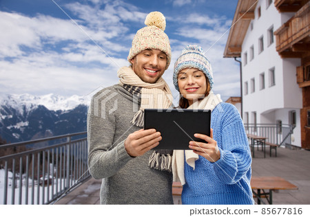 couple with tablet computer in winter couple with tablet computer in winter 85677816