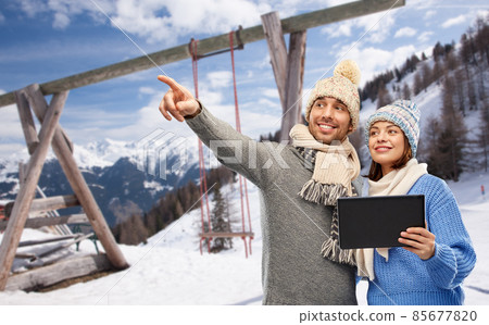 couple with tablet computer in winter couple with tablet computer in winter 85677820