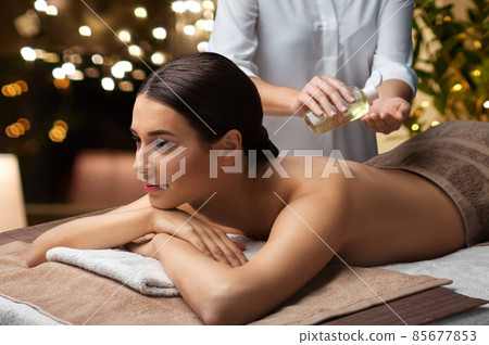 beautiful woman having back massage at spa beautiful woman having back massage at spa 85677853