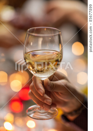 close up of man drinking wine at christmas party close up of man drinking wine at christmas party 85677899