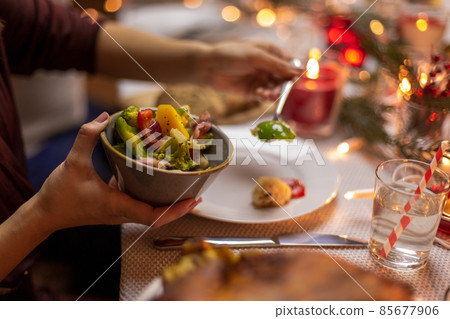 female hands with food at christmas dinner 85677906