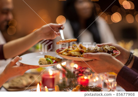close up of people share food at christmas dinner 85677908