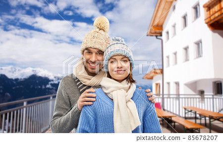 couple in winter over mountains and ski resort 85678207