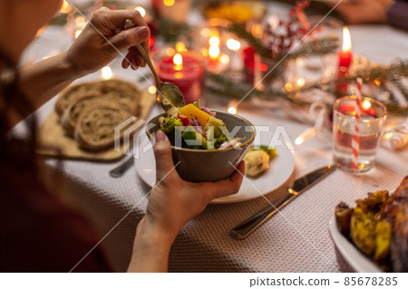 female hands with food at christmas dinner 85678285