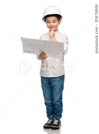 little boy in construction helmet with blueprint 85678606