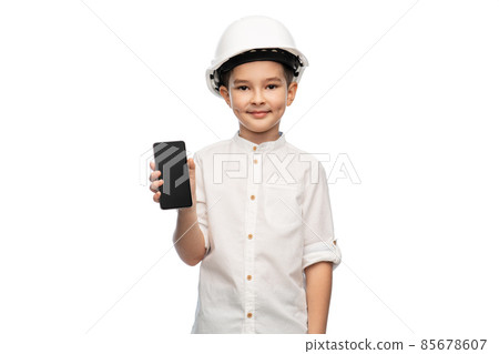 little boy in construction helmet with smartphone little boy in construction helmet with smartphone 85678607