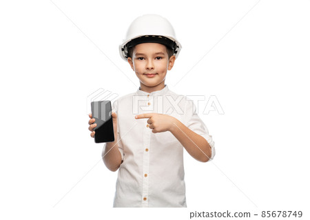 little boy in construction helmet with smartphone little boy in construction helmet with smartphone 85678749